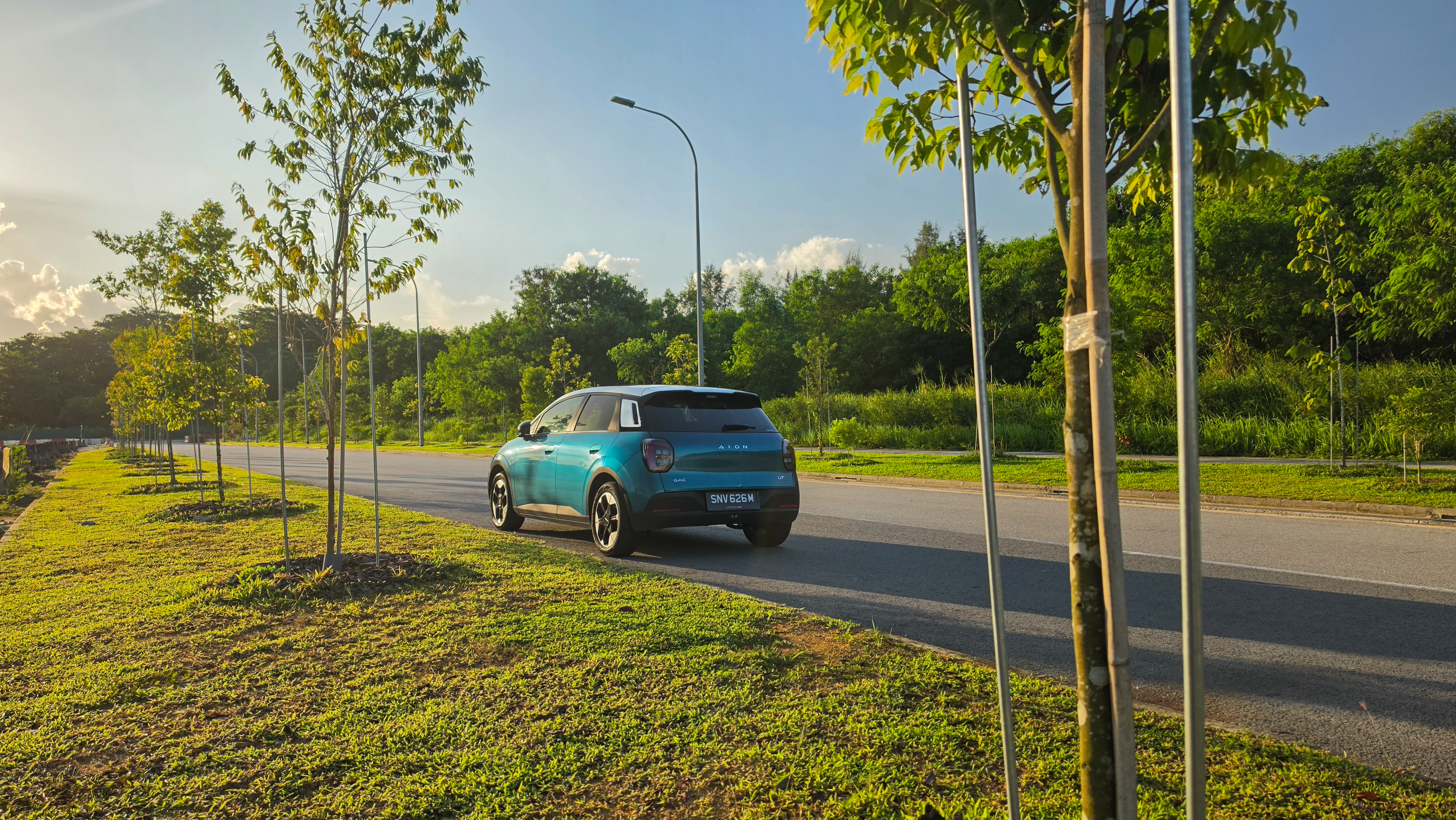 AION UT on the road, rear three-quarter view