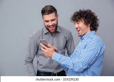 portrait two laughing men using 260nw 319239230.webp