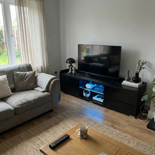 This black tv unit is a great addition to my lounge.png