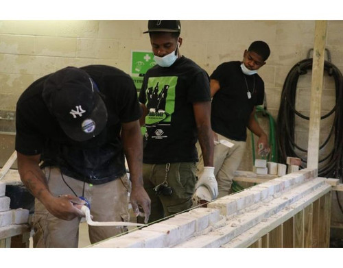 Students undergoing hands on construction training in construction school 768x512.jpg