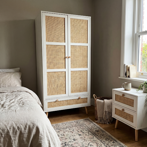 Our rattan double wardrobe held a fortnight of guest clothes.png