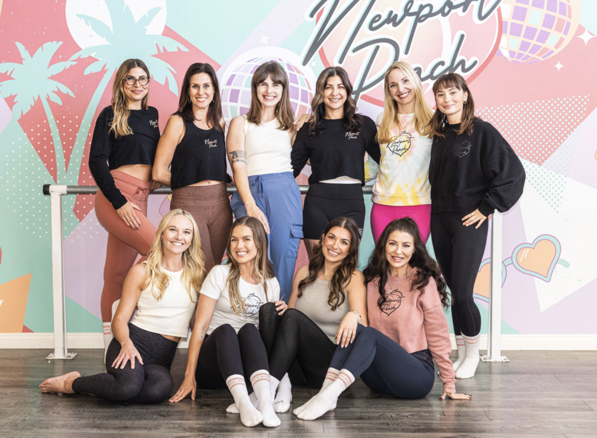 Newport Peach instructor team gathered inside the Costa Mesa studio