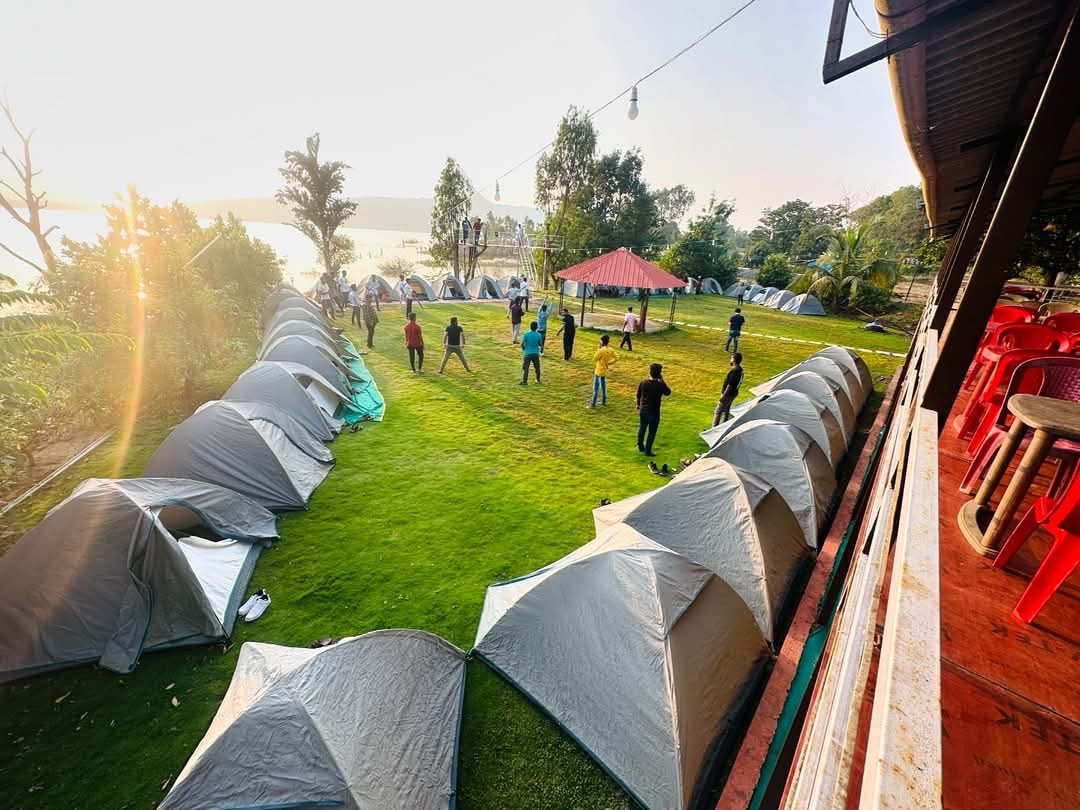 Guests playing games on the lawn between the tents