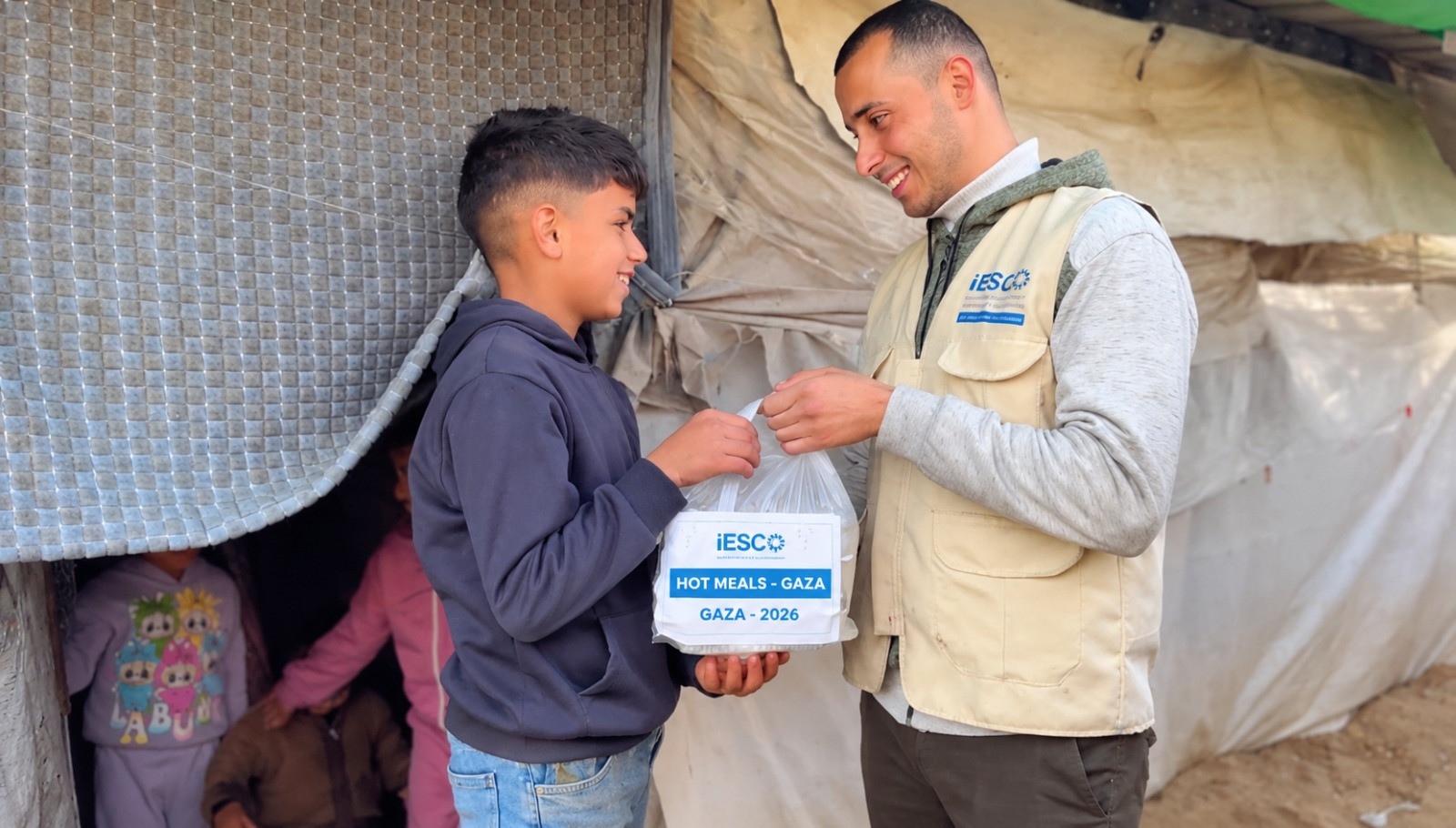 Families receiving hot meals in Gaza