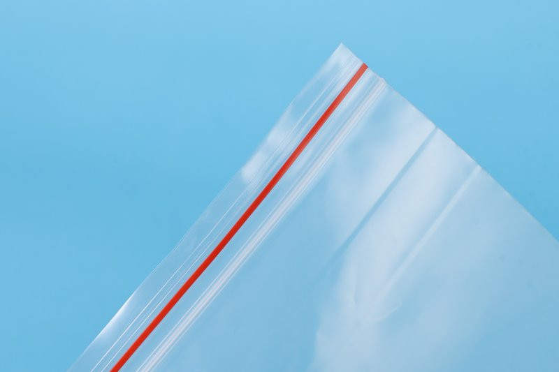 Close-up of a clear PE ziplock bag sealing line produced on the factory converting line