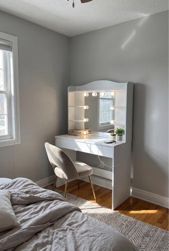 A well-lit dressing table with mirror and lights simplifies daily grooming in compact UK bedrooms.2