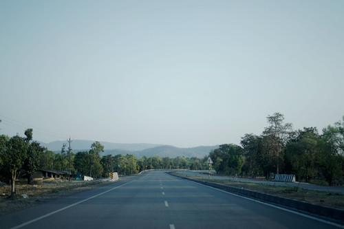How far is Ghatshila from Jamshedpur, and how can I travel between them?