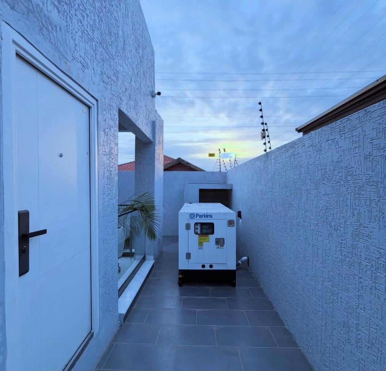 Luxury Contemporary Residential Estate - Side utility corridor and dedicated Perkins backup generator setup