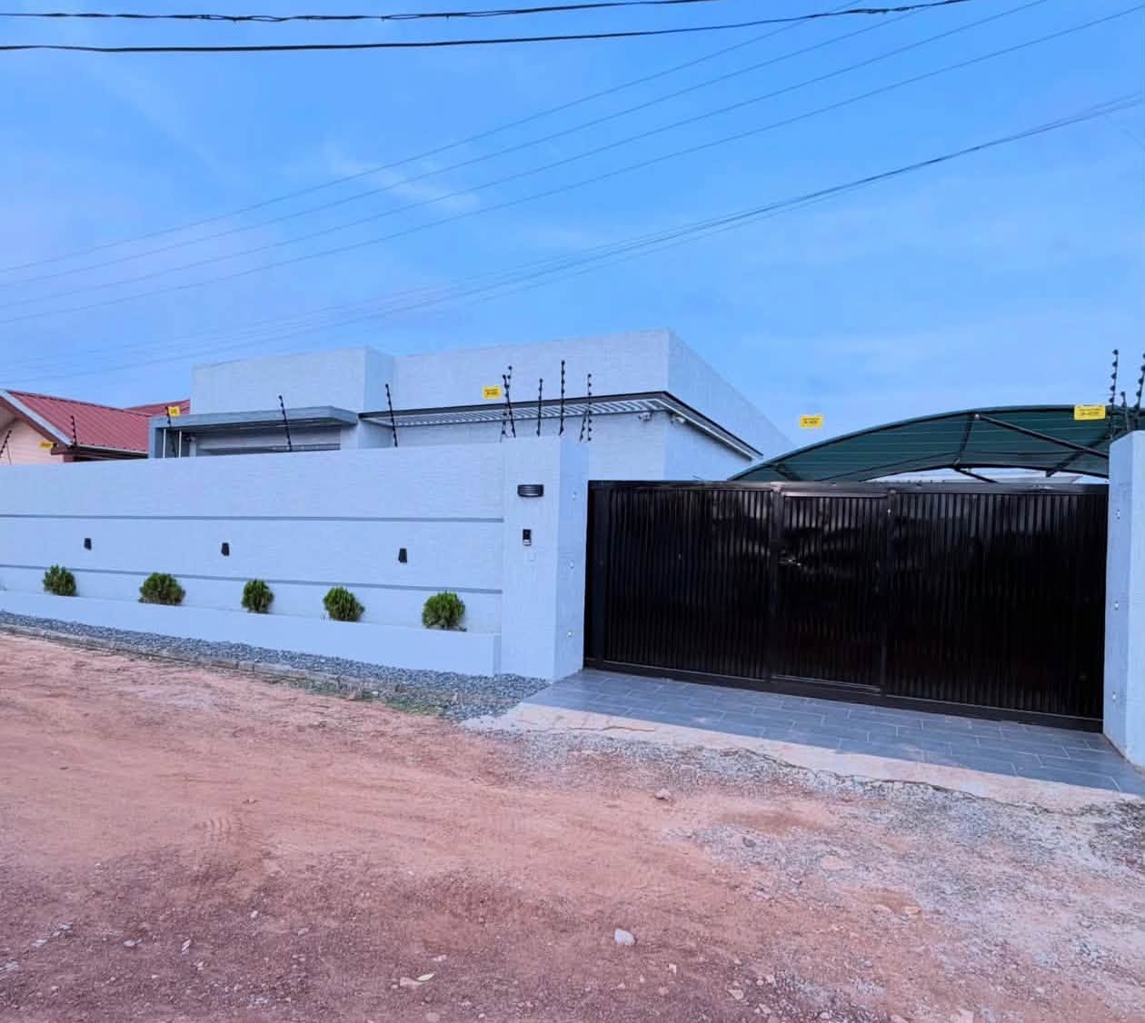 Luxury Contemporary Residential Estate - Perimeter boundary wall with electric security fence and modern sliding gate
