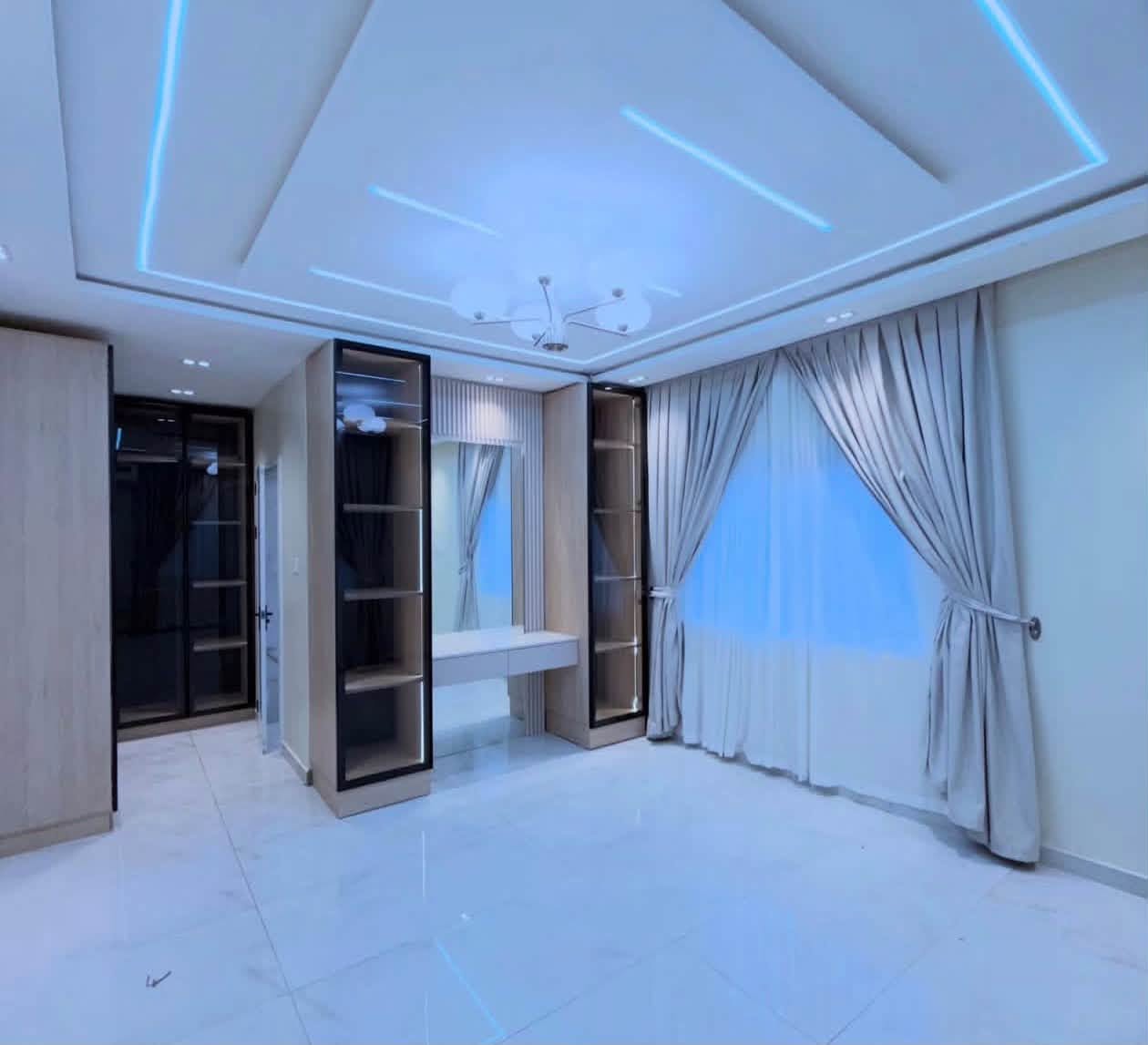 Luxury Contemporary Residential Estate - Master bedroom suite with architectural ceiling, dressing table, and ambient lighting