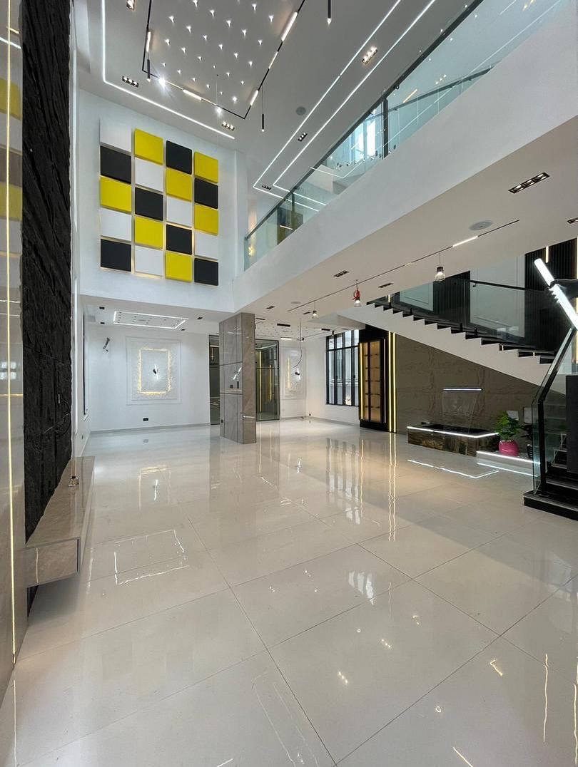 Luxury 6-Bedroom Contemporary Home - Perimeter fence and exterior lights view 12