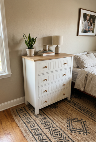 White and oak on a four-drawer chest that brightens up a compact bedroom.2