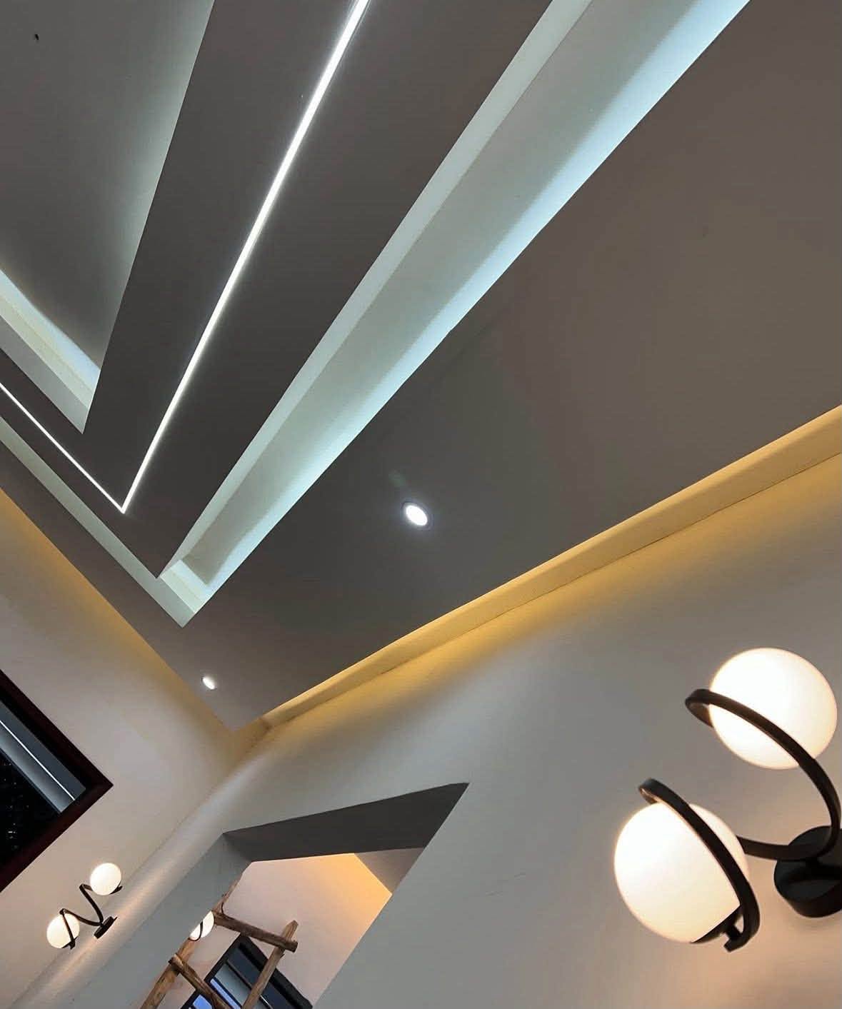 Contemporary Residential Villa - Custom POP false ceiling design with warm LED cove lighting