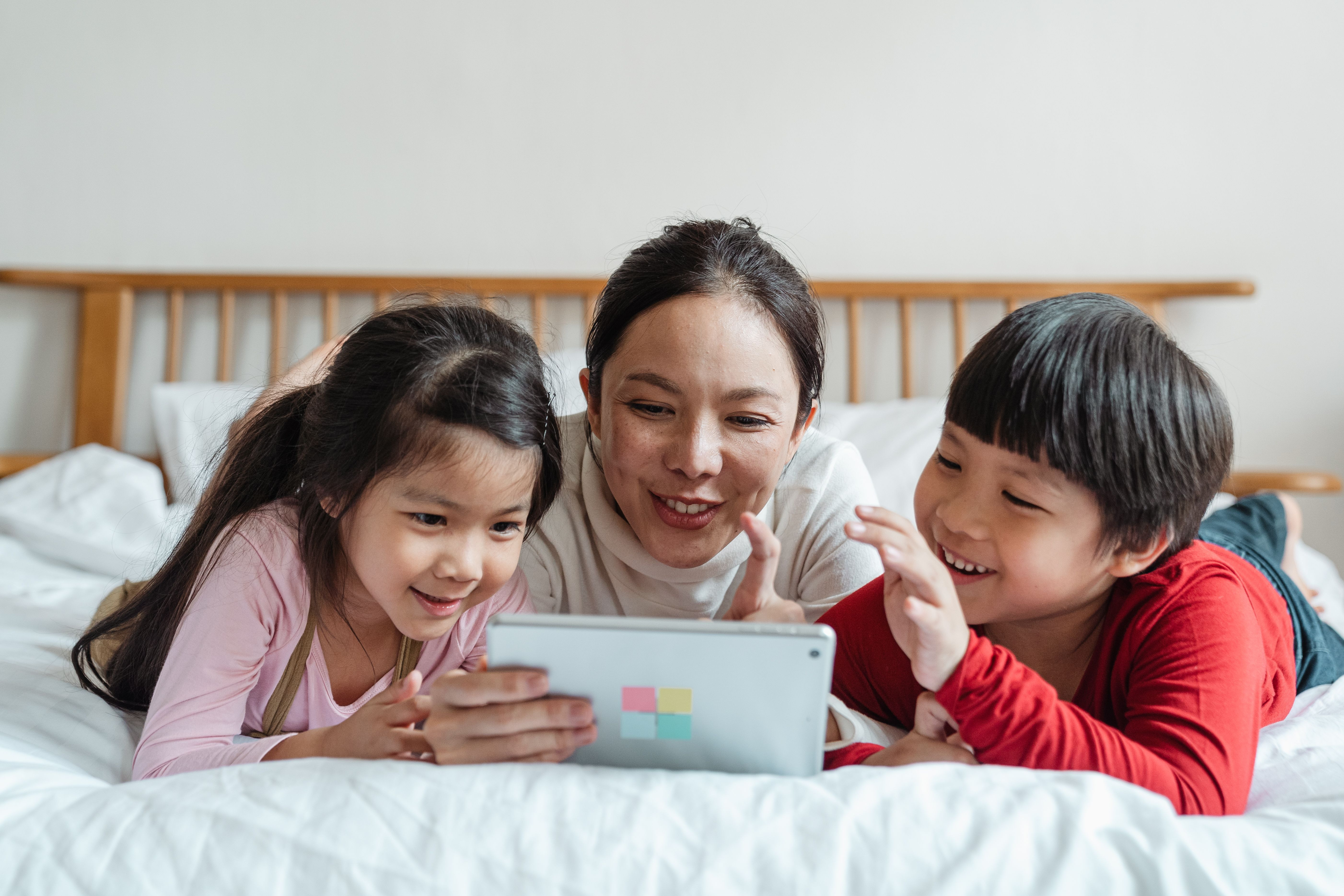Family playing the Cyber Safety Game together on a tablet