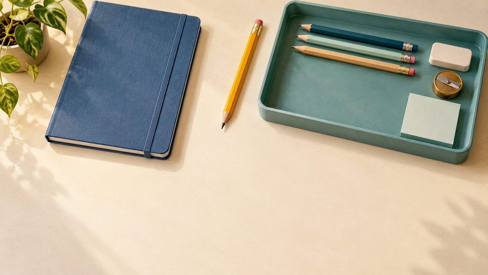 Editorial illustration of a desk with a teal tray, a notebook, pencils, and a clear patch of workspace.