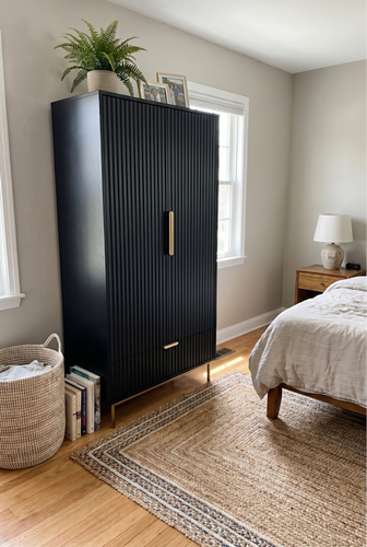 A black two-door wardrobe that proves compact frames can still deliver serious hanging depth.2