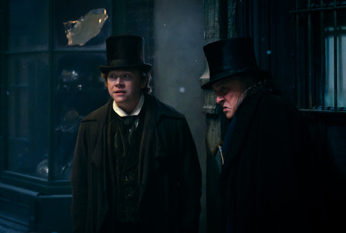 Rupert Grint plays Bob Cratchit and Johnny Depp plays Ebenezer Scrooge in Ebenezer from Paramount Pi