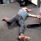 dead 01 white man wearing tight jeans t shirt and cowboy boots sprawled out on the floor funny anima.gif