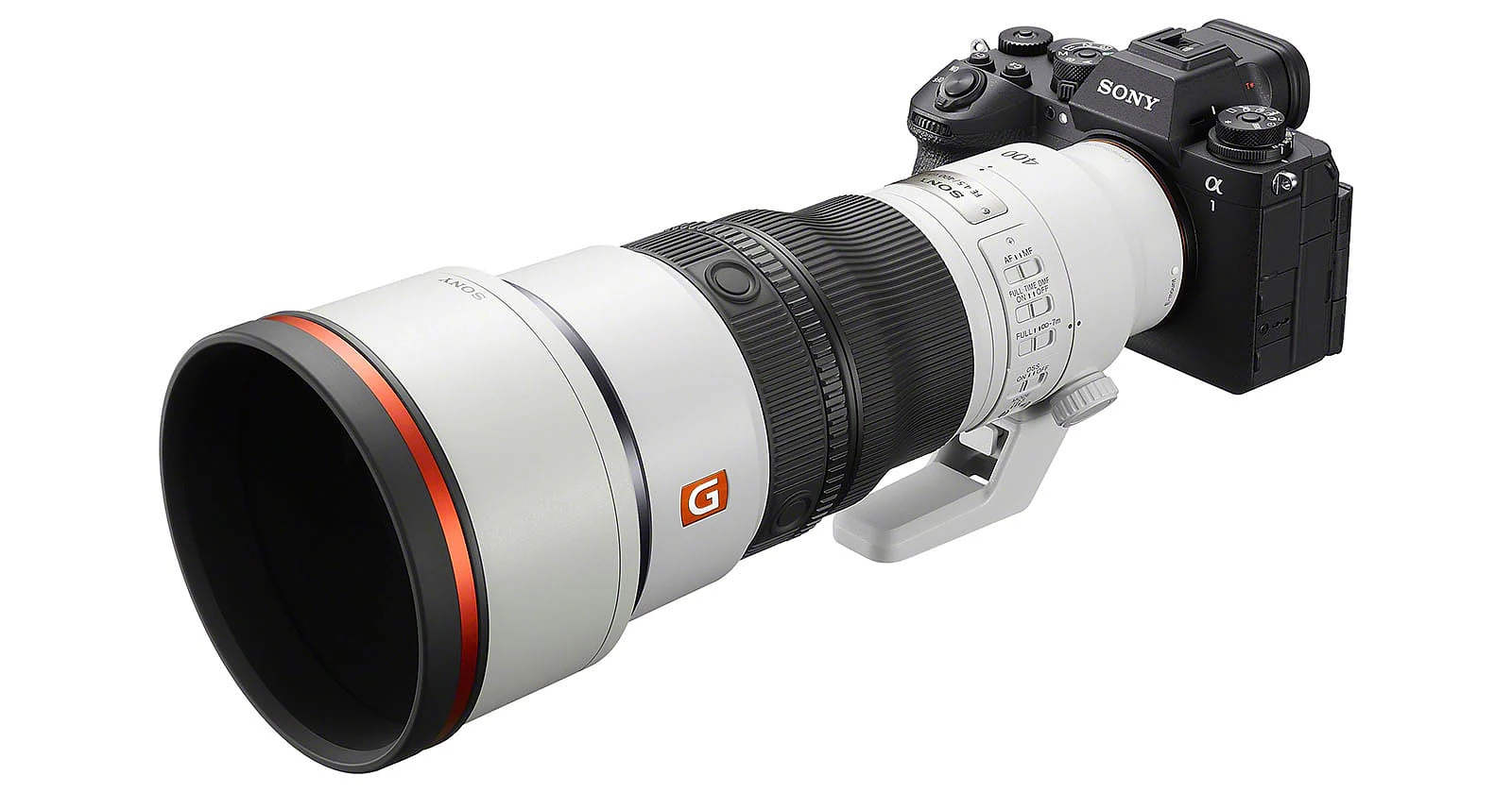 A Sony Alpha mirrorless camera attached to a large white telephoto lens with a black lens hood and an orange ring, shown against a white background.