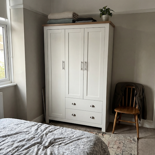 Getting my small bedroom sorted with this white wardrobe with drawers.png