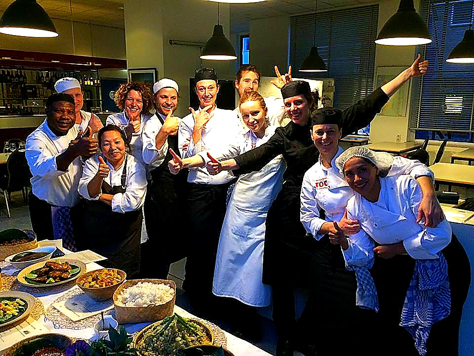 Vivid mid-article photo of chefs using commercial restaurant cooking equipment