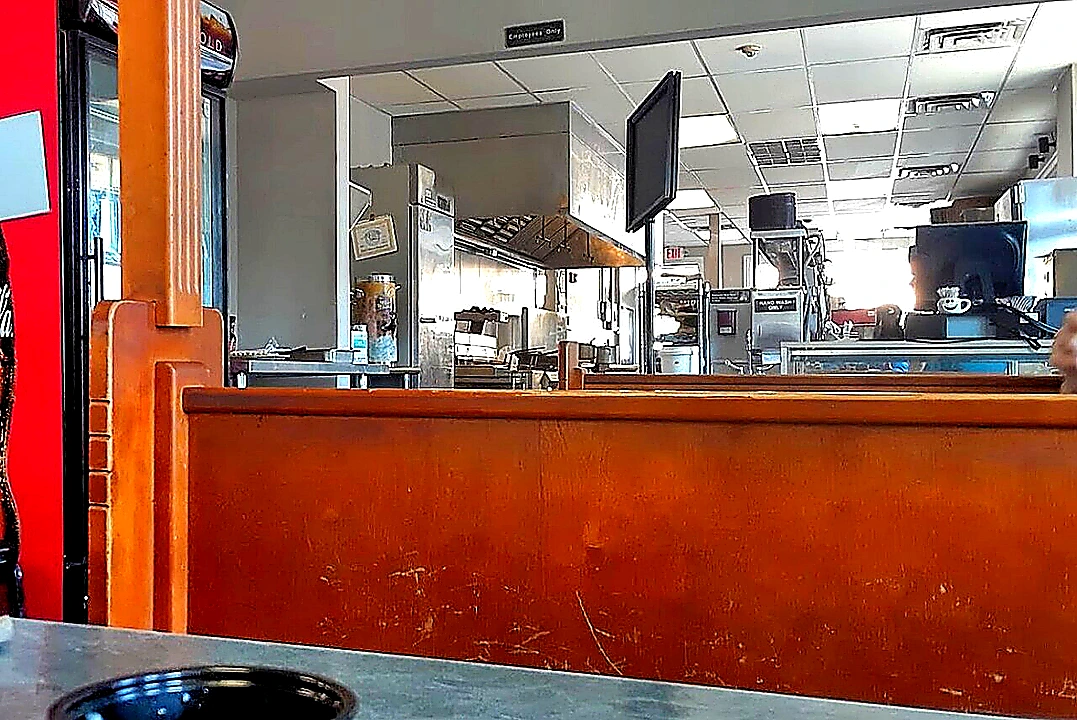 Sharp closing photo of organized commercial refrigeration and prep stations