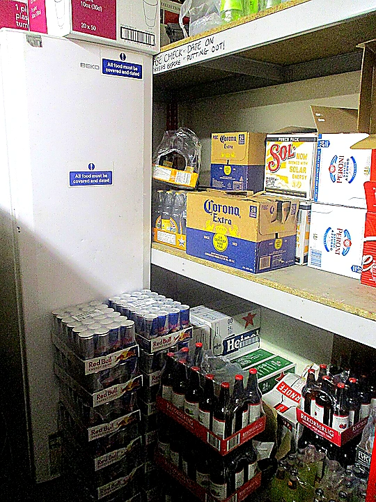 Sharp closing photo of organized commercial refrigeration and prep stations