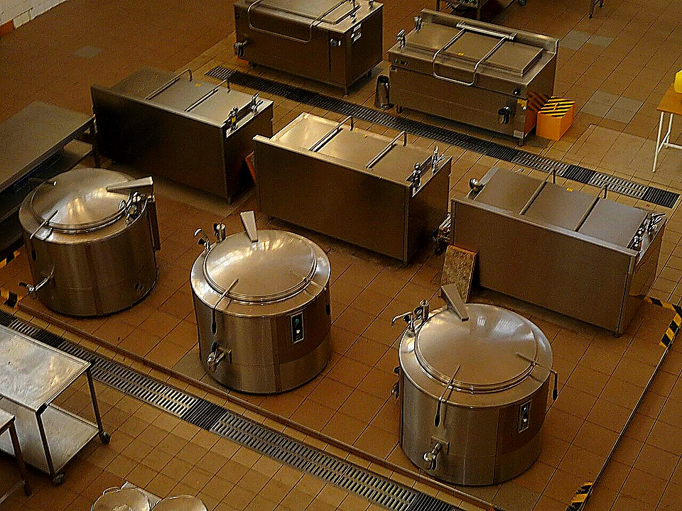 Sharp closing photo of organized commercial refrigeration and prep stations