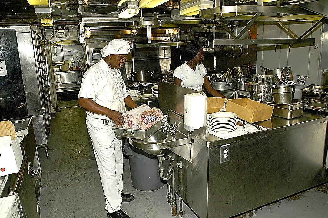 Sharp closing photo of organized commercial refrigeration and prep stations