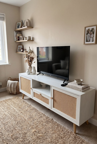 The open shelf trick for a styled white tv unit.2