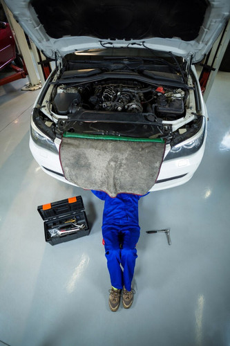 female mechanic repairing car 1170 1226.jpg