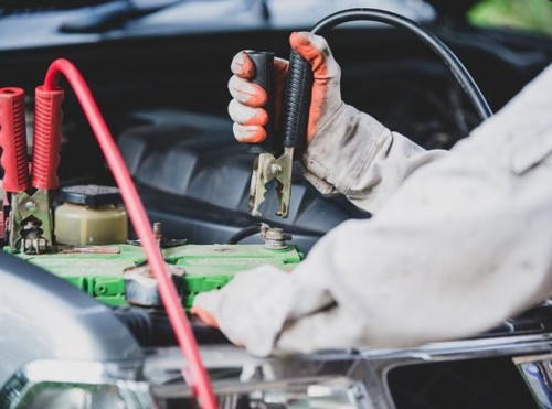 car repairman wearing white uniform standing holding wrench that is essential tool mechanic 1150 165.jpg