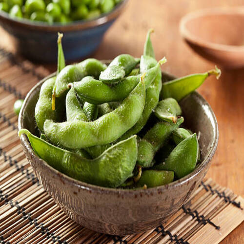 Cooked Green Organic Edamame with sea salt against a background.jpg