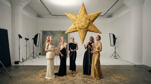 a wide shot of a group of beautiful joyful caucasian top models, wearing luxury modern minimal saint.png