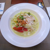 Soto Ayam (chicken soto) a breakfast dish in Savoy Homann Hotel, Bandung. Chicken in spicy yellow tu
