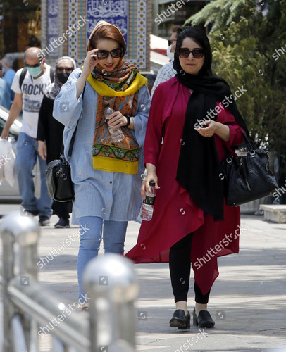iranian women walk street tehran iran 12 1500w 13027431d.jpg
