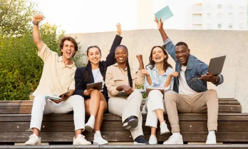 depositphotos 670274584 stock photo thrilled happy multiracial group students.webp