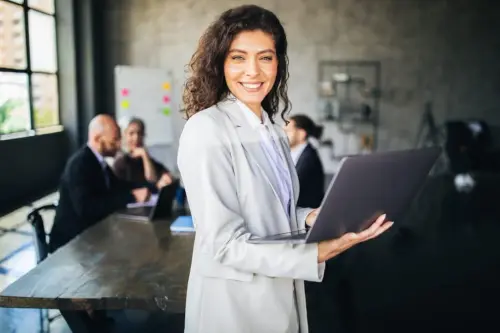 Professional-woman-working-on-a-laptop.webp