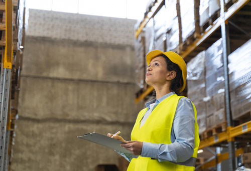 woman with helmet working warehouse.jpg
