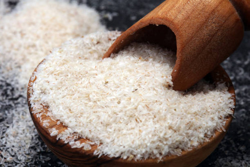 Portion of Psyllium Seeds on rustic dark background. Psyllium seed husks..jpg