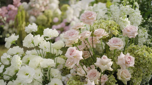 Close up floral arch wedding set up green on lawn..jpg