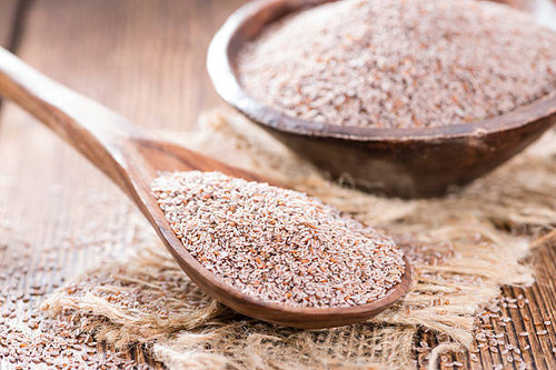Portion of Psyllium Seeds on rustic wooden background.jpg
