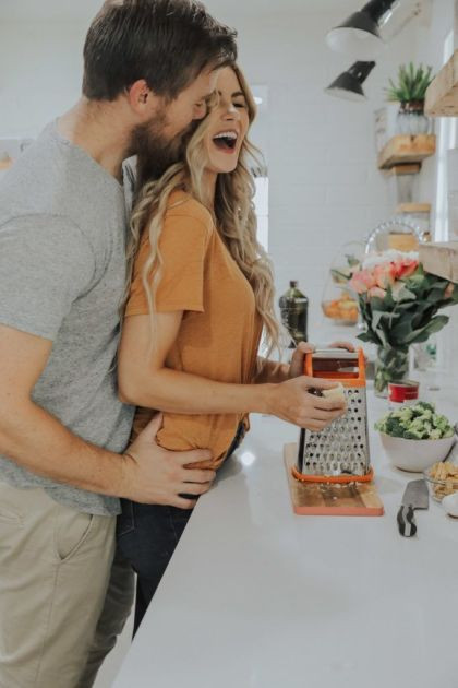 Joy in the Kitchen: A Loving Couple Sharing a Happy Moment Together