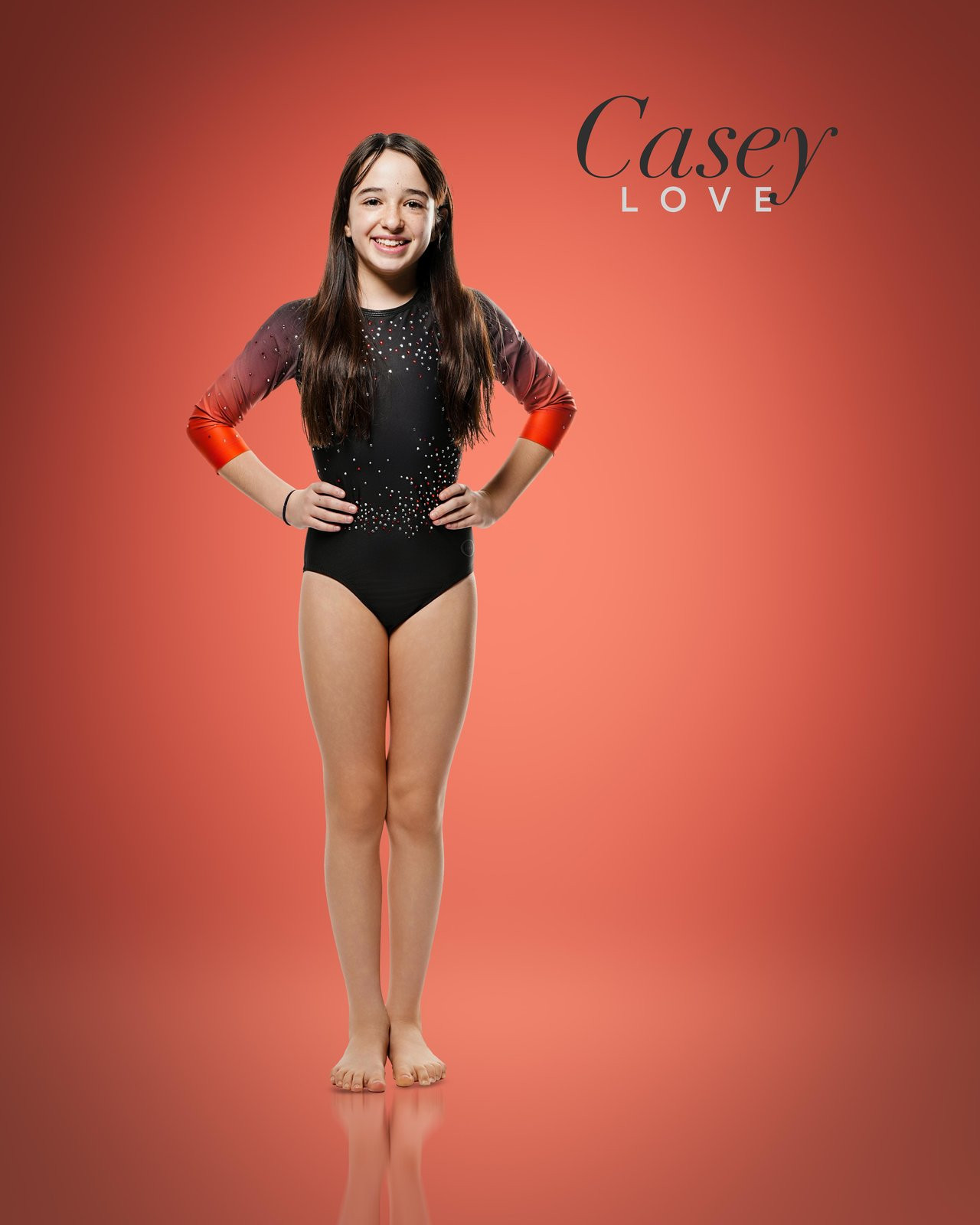 Casey Love dancer portrait on red backdrop