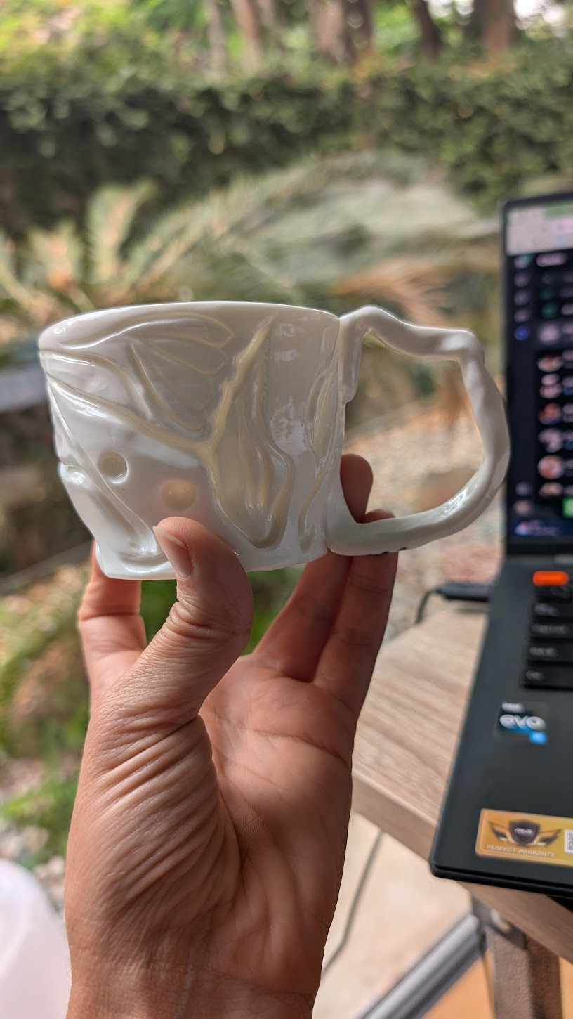 Glazed porcelain cup showing translucent thin areas