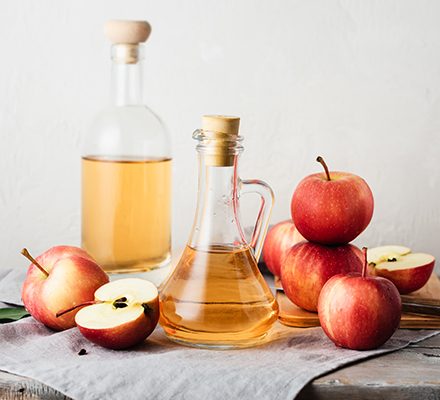 Apple cider vinegar and fresh red apples..jpg