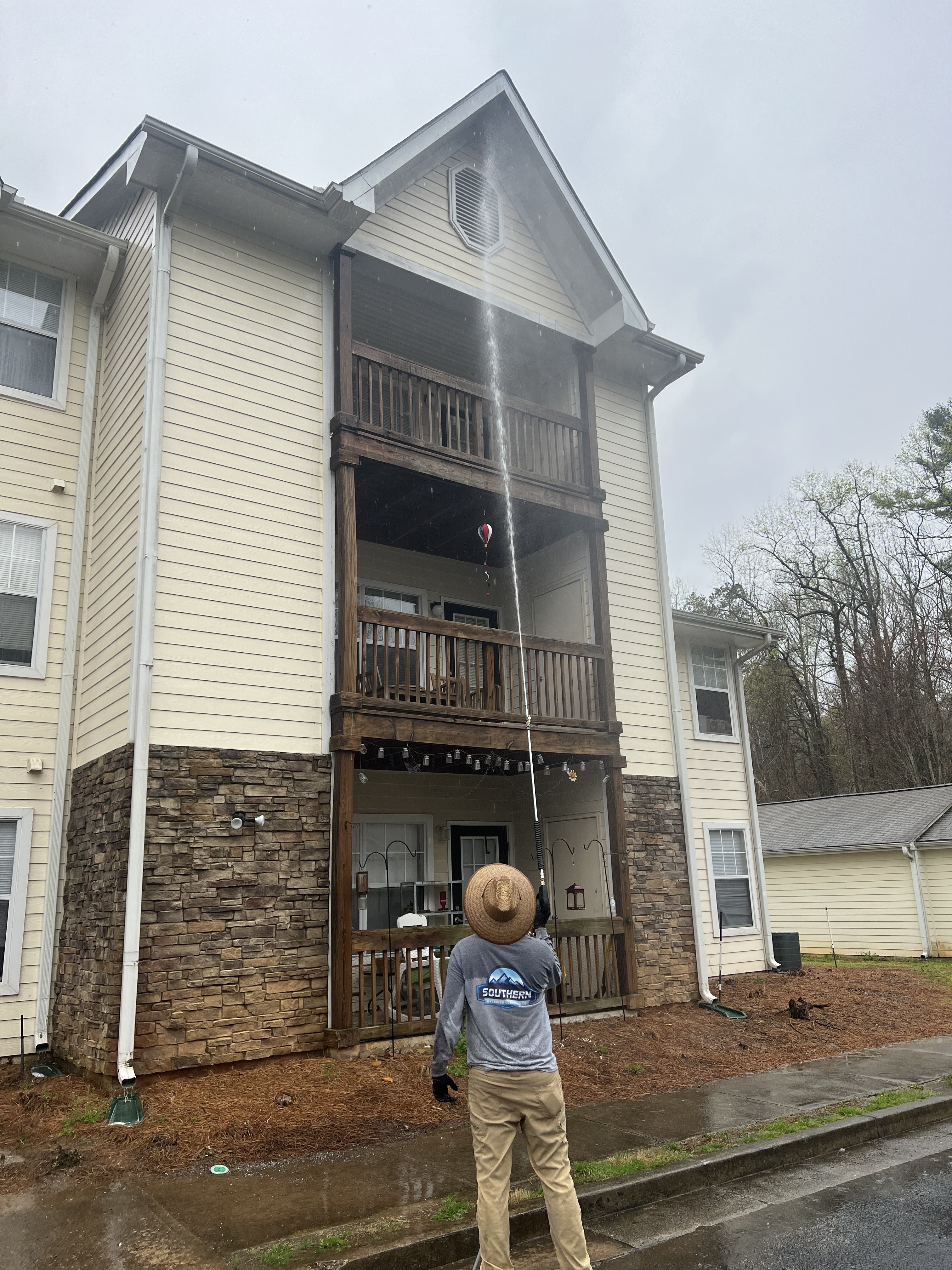 Southern Exterior Cleaning crew soft washing a North Georgia mountain home