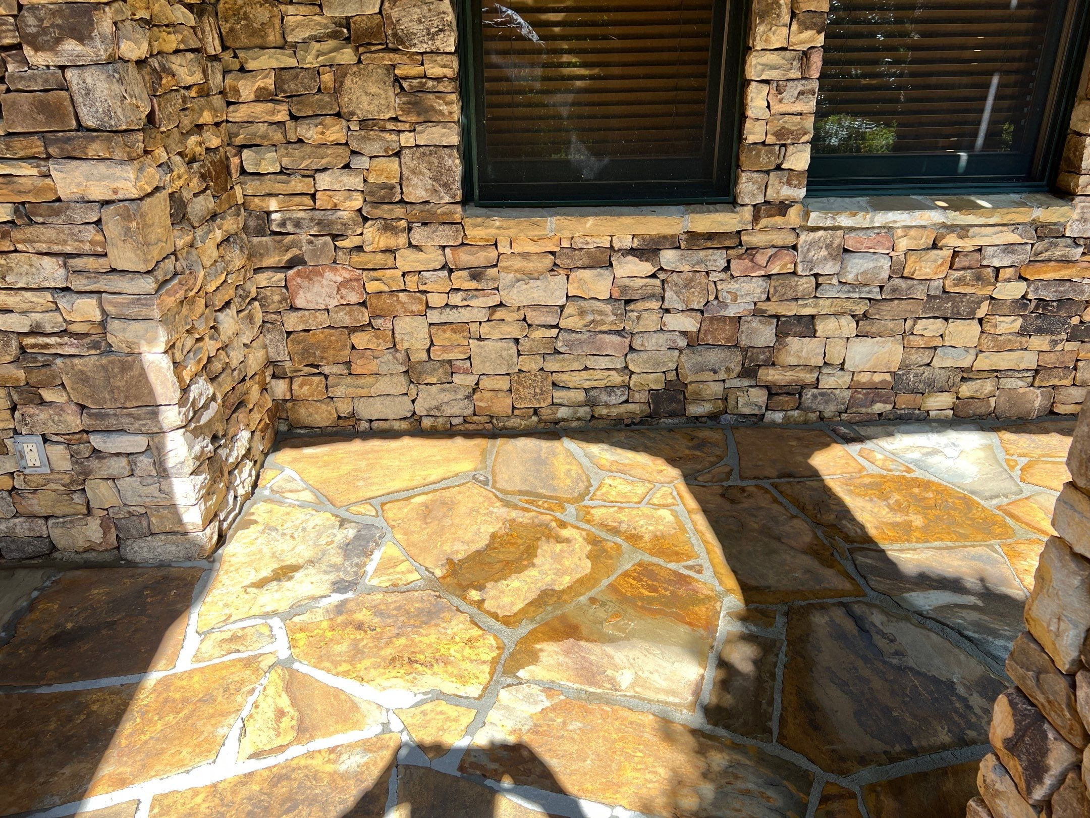 Stone patio after professional pressure washing by Southern Exterior Cleaning