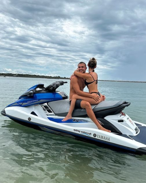 Love on the Waves: A Couple Sharing a Joyful Ride on a Jet Ski