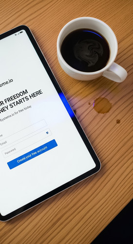 199 Topdown view of a tablet showing a checkout page and a cup of coffee Text YOUR FREEDOM JOURNEY S.jpg